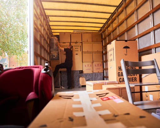 Removal company helping a family move out of their old home